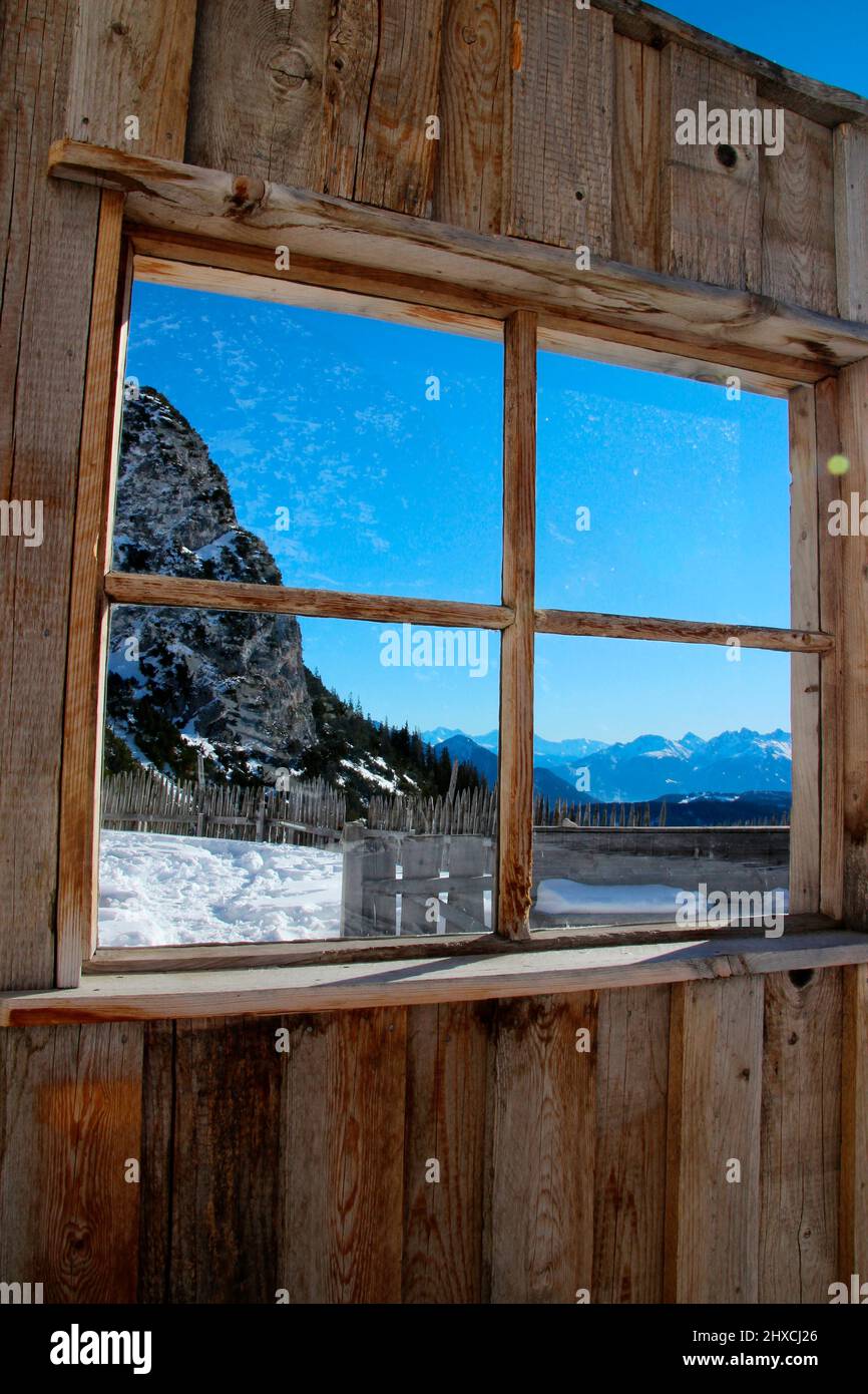 Winter hike to the Wang Alm in the Gaistal, window with mountain panorama, Austria, Tyrol, vacation, winter, dream weather Stock Photo