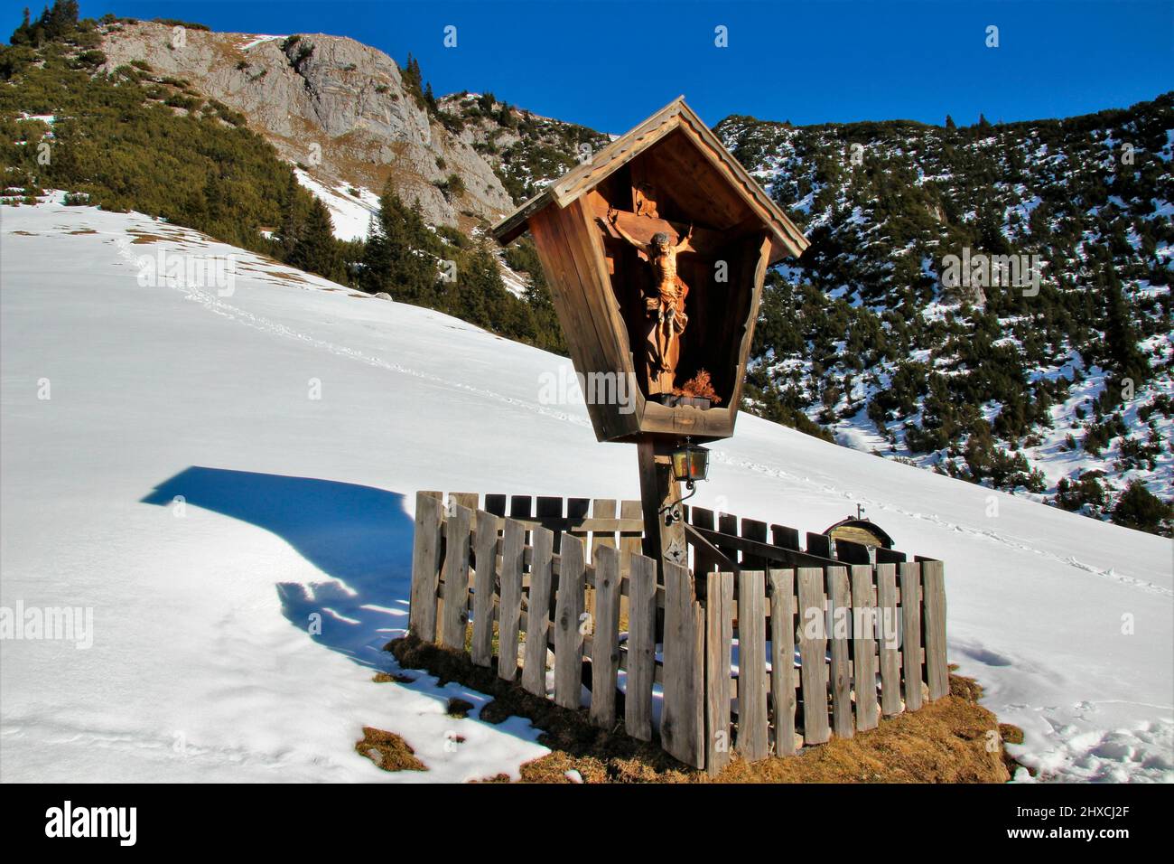 Winter hike to the Wang Alm in the Gaistal, mountain cross in the Austrian Wetterstein Mountains, Austria, Tyrol, vacation, winter, dream weather Stock Photo