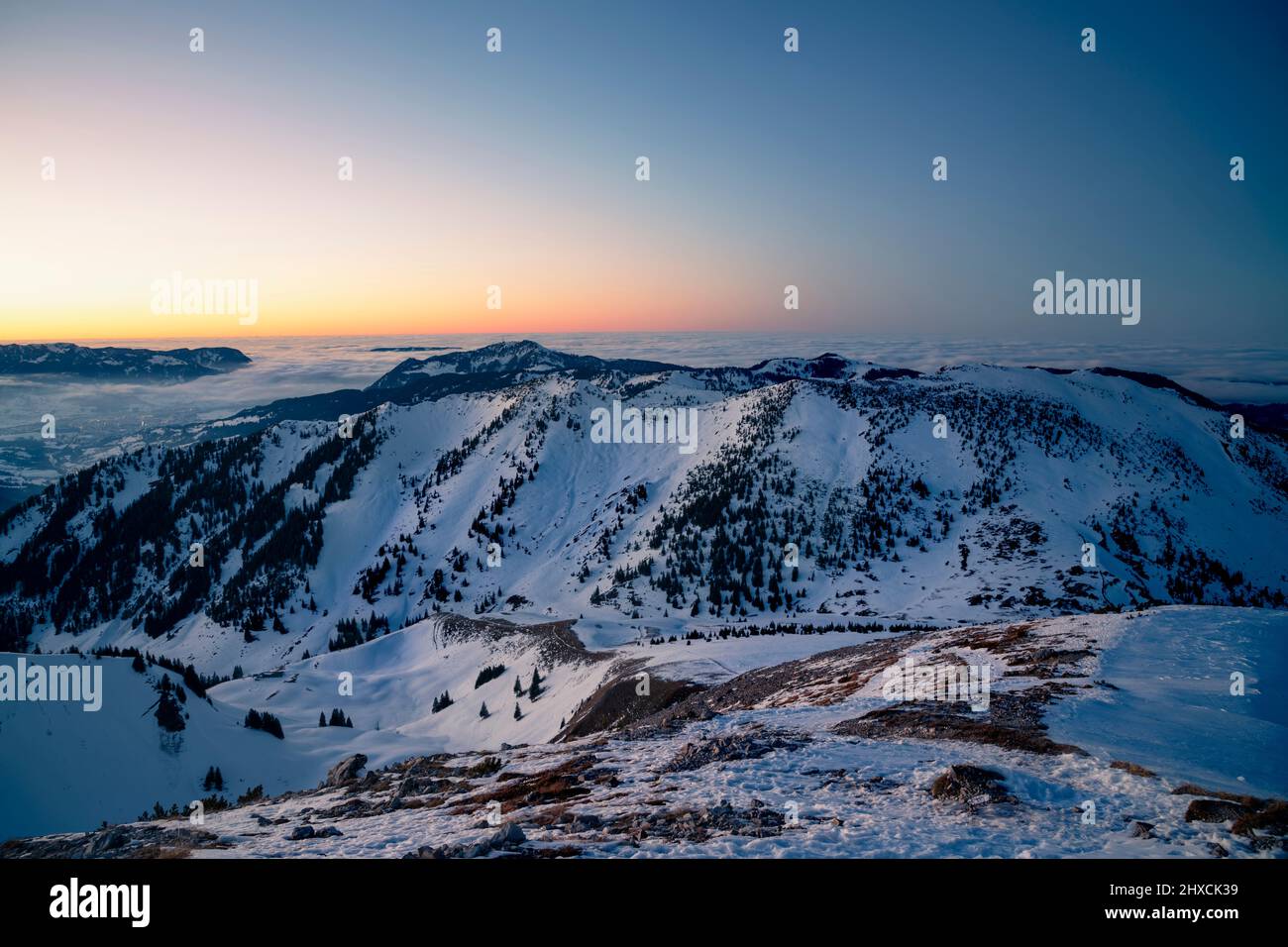 Alpine mountain landscape on a cold winter day after sunset. View from the top of Bscheisser towards Illertal valley. Allgäu Alps, Bavaria, Germany, Europe Stock Photo