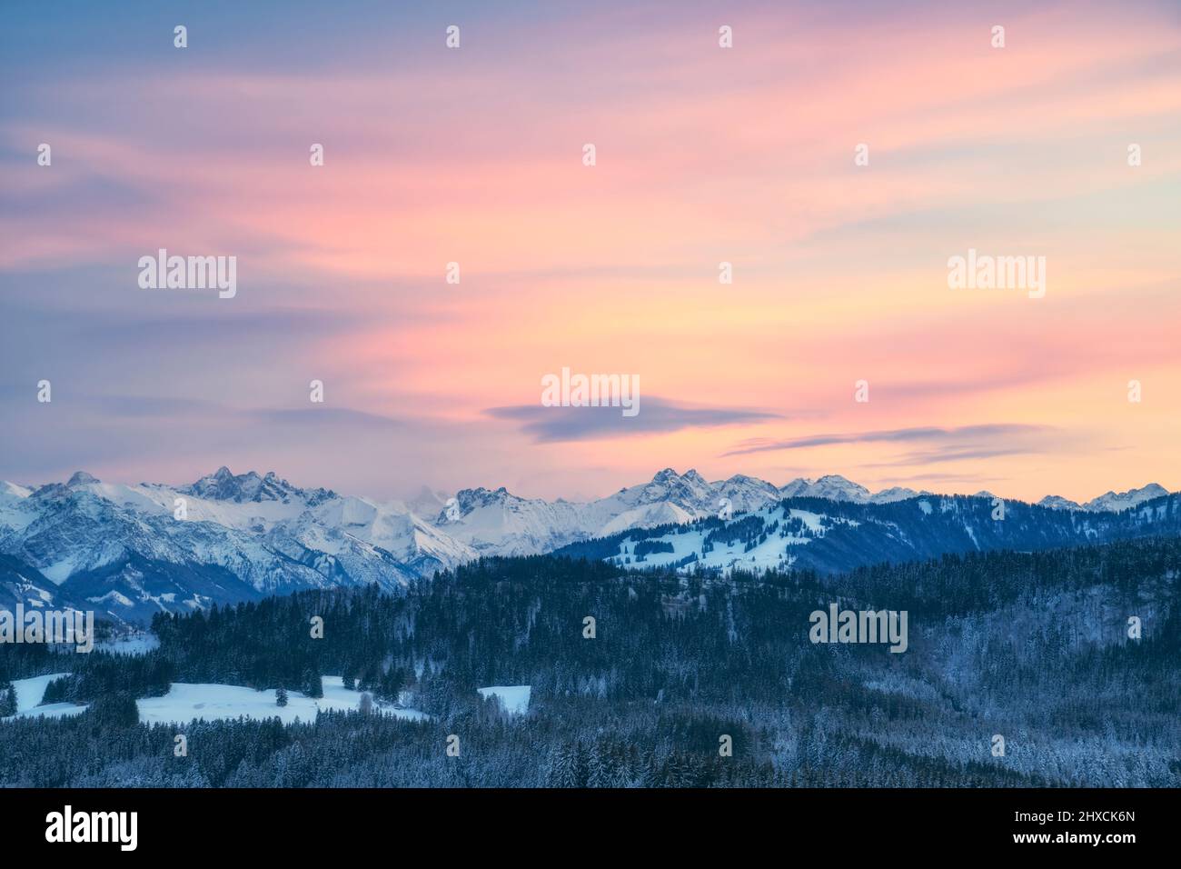 Evening glow over the winter snowy Allgäu Alps. Bavaria, Germany, Europe Stock Photo