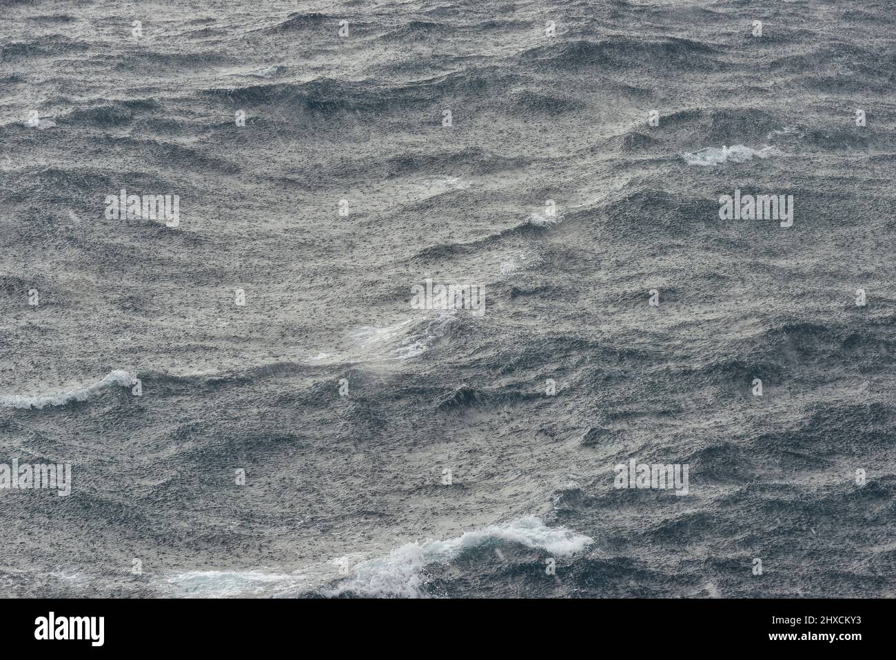 Heavy rain on high waves in sea, Catalonia, Spain Stock Photo