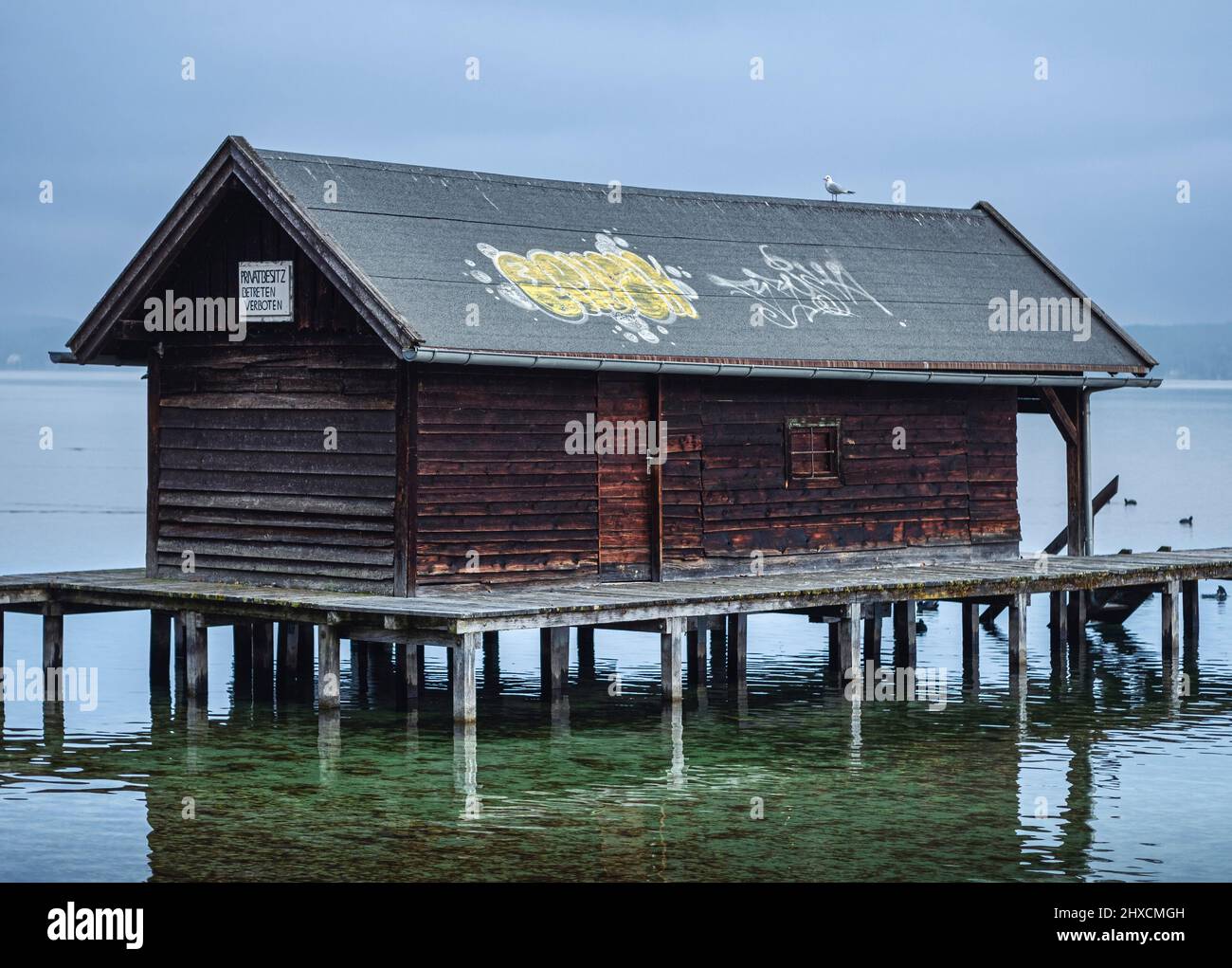 Boathouse smeared with graffiti, Starnberger See, Tutzing, Fünfseenland, Upper Bavaria, Bavaria, Germany, Europe Stock Photo