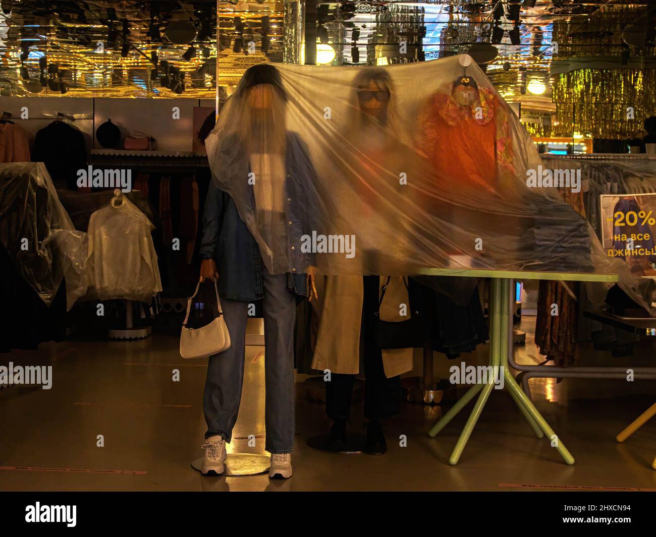 Usually, the bright Monki store is immersed in darkness. Mannequins and hangers with clothes are covered with a plastic film. In the first week of March, many foreign companies announced the termination of their activities in Russia. Stock Photo