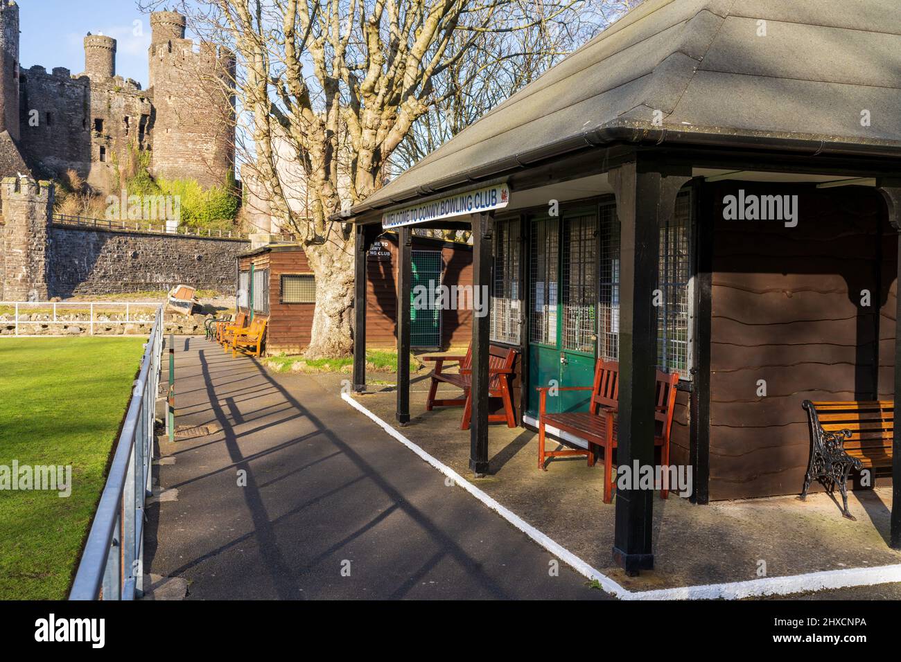 Conwy Wales UK March 2022 Conwy bowls club house and outside seating area with castle in background Stock Photo