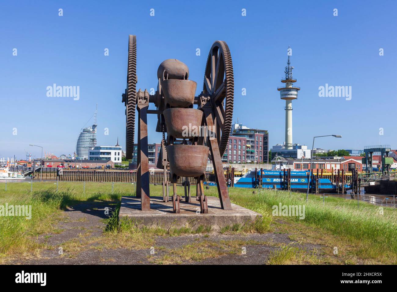 Monument bucket chain excavator, modern architecture, directional radio tower and car ferry to Nordenham on the Geeste, Bremerhaven, Bremen, Germany, Europe Stock Photo