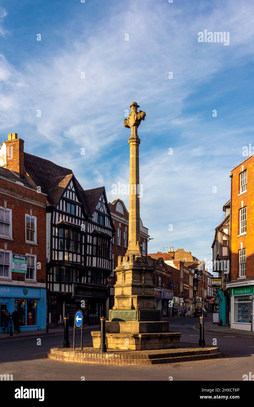 Traditional buildings and shops in the centre of Tewkesbury a town in Gloucestershire England UK with the War Memorial or The Cross in the foreground. Stock Photo