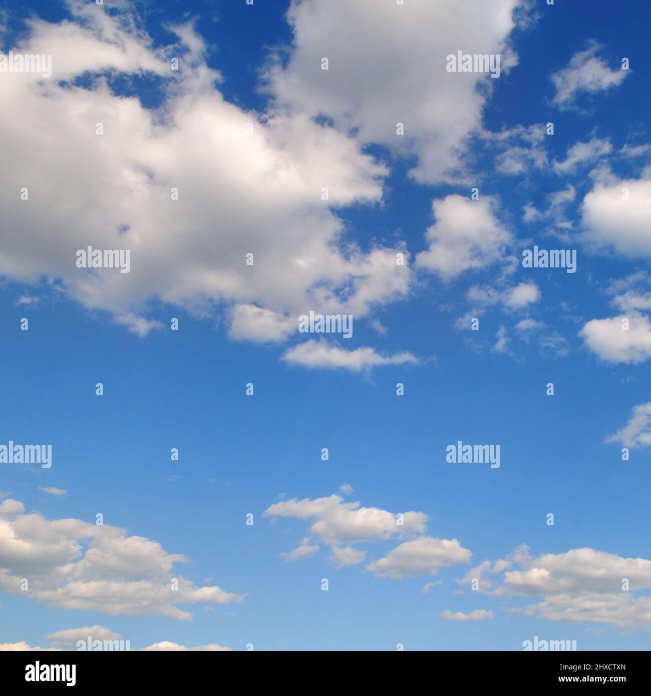 Light cumulus clouds in the blue sky. A bright sunny day Stock Photo ...