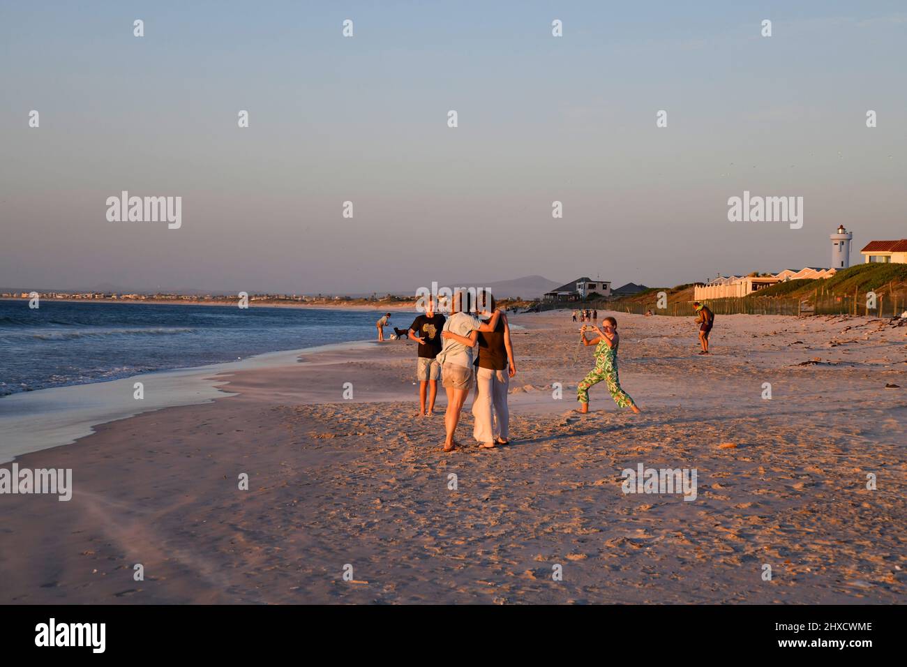 family on Milnerton Beach, Cape Town, South Africa. Stock Photo
