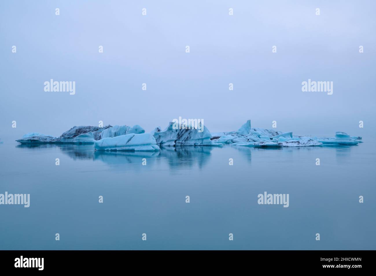 Glacier lagoon, ice, floes, fog, clouds, evening, summer, Jokulsarlon, Austurland, Iceland Stock Photo