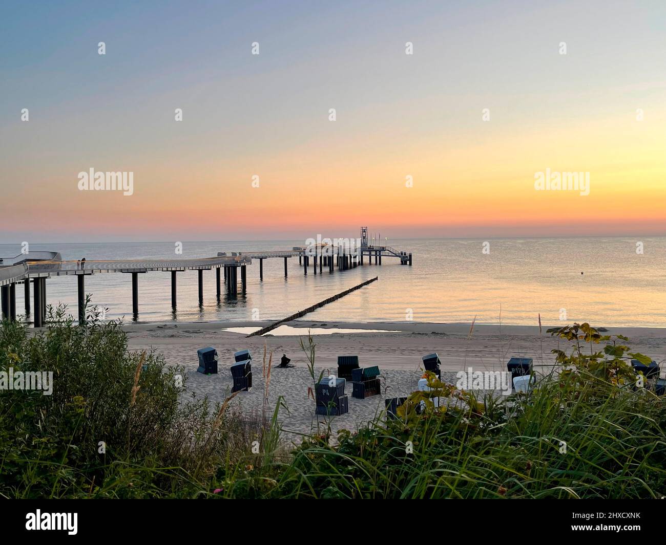 View of the new pier in Koserow on Usedom opened in 2021 in the morning with deserted beach Stock Photo