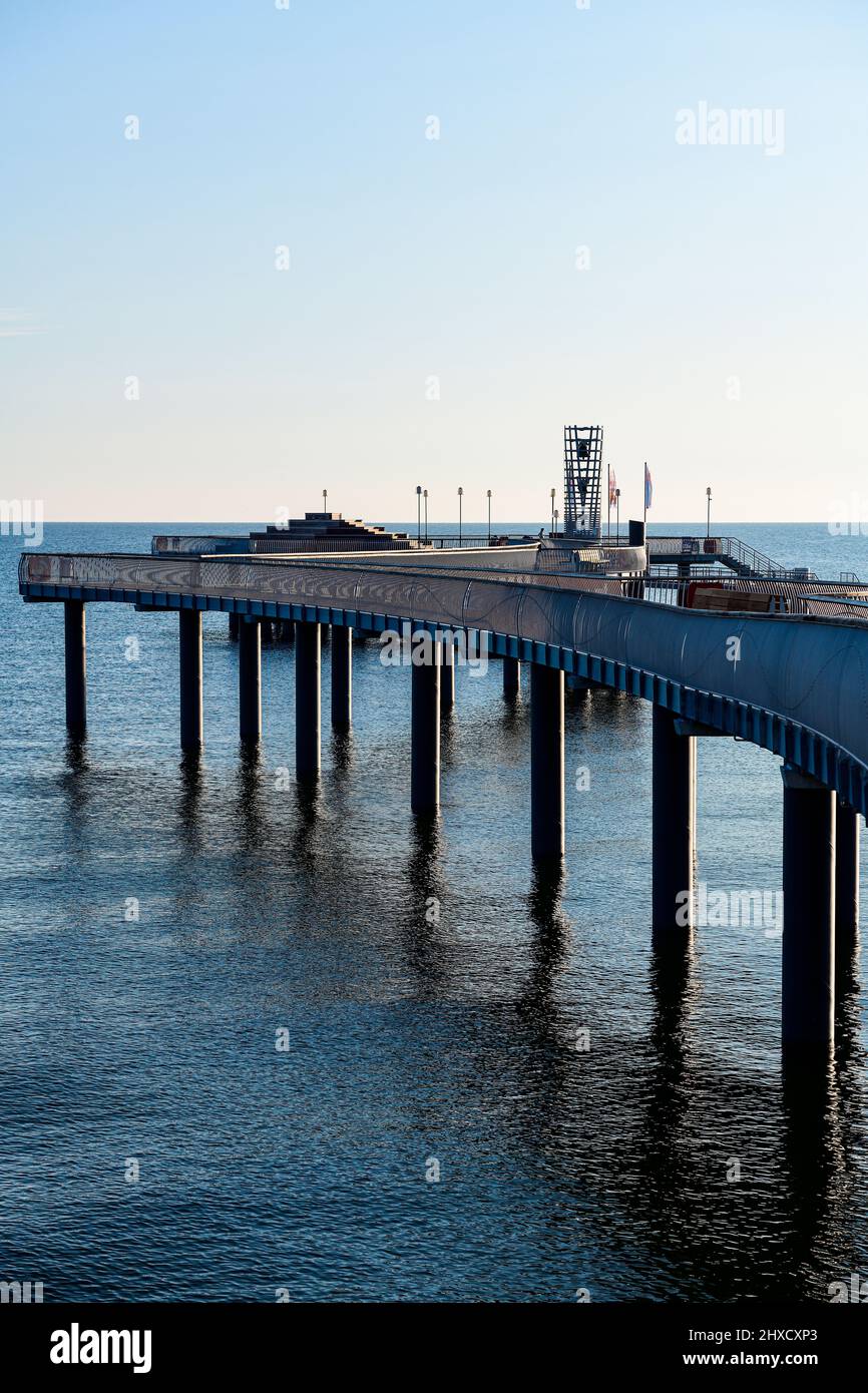 View of the pier in Koserow opened in 2021 at sunrise in summer from the side Stock Photo