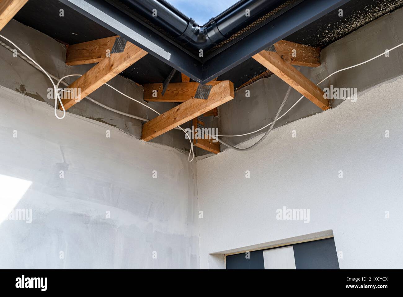 Roof trusses through which the electric cable passes to connect the