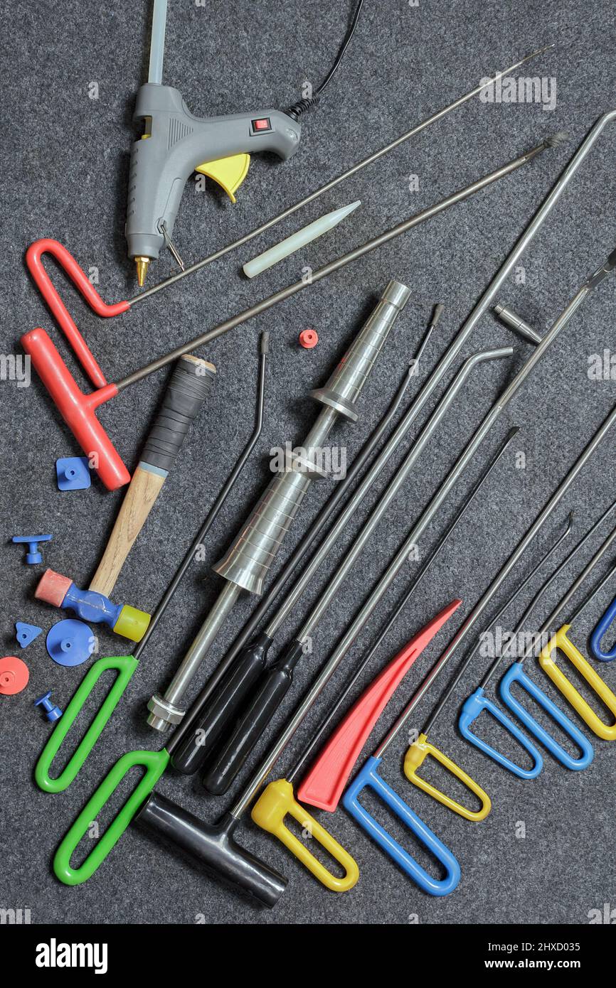 Paintless Dent Repair Kit Tools Set On The Work Table. Stock Photo