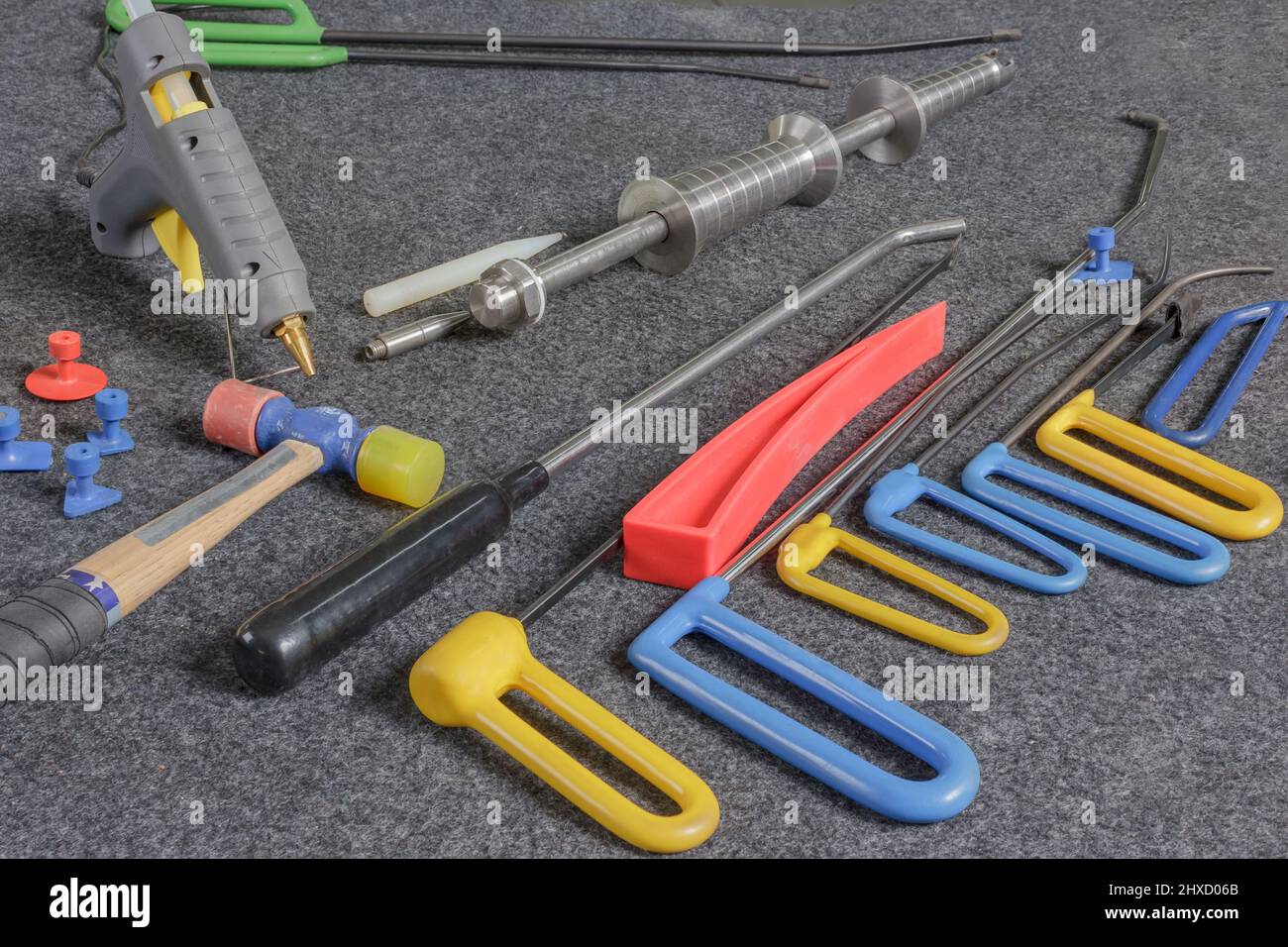 Paintless Dent Repair Kit Tools Set On The Work Table. Tools For Repair Dents On Car Body. Stock Photo
