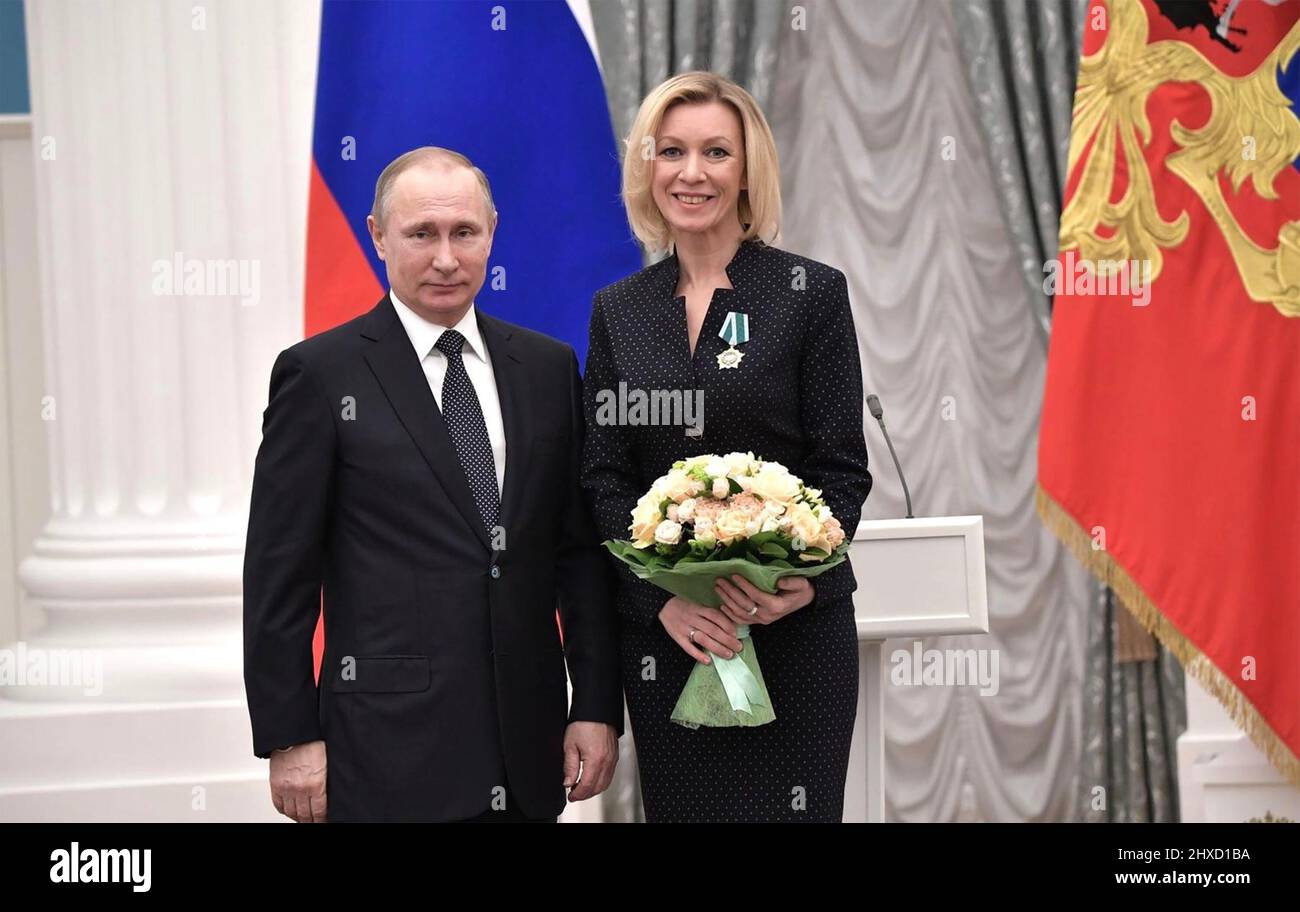 MARIA ZAKHAROVA Director pf the Press and Information Department of the Russian Ministry of Foreign Affairs in with Vladimir Putin a 2017 photo. Photo: Russian Federation  Council Stock Photo