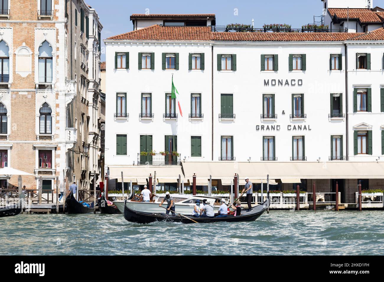 Gondola ferry in front of Hotel Monaco & Gran Canal on the Grand Canal ...