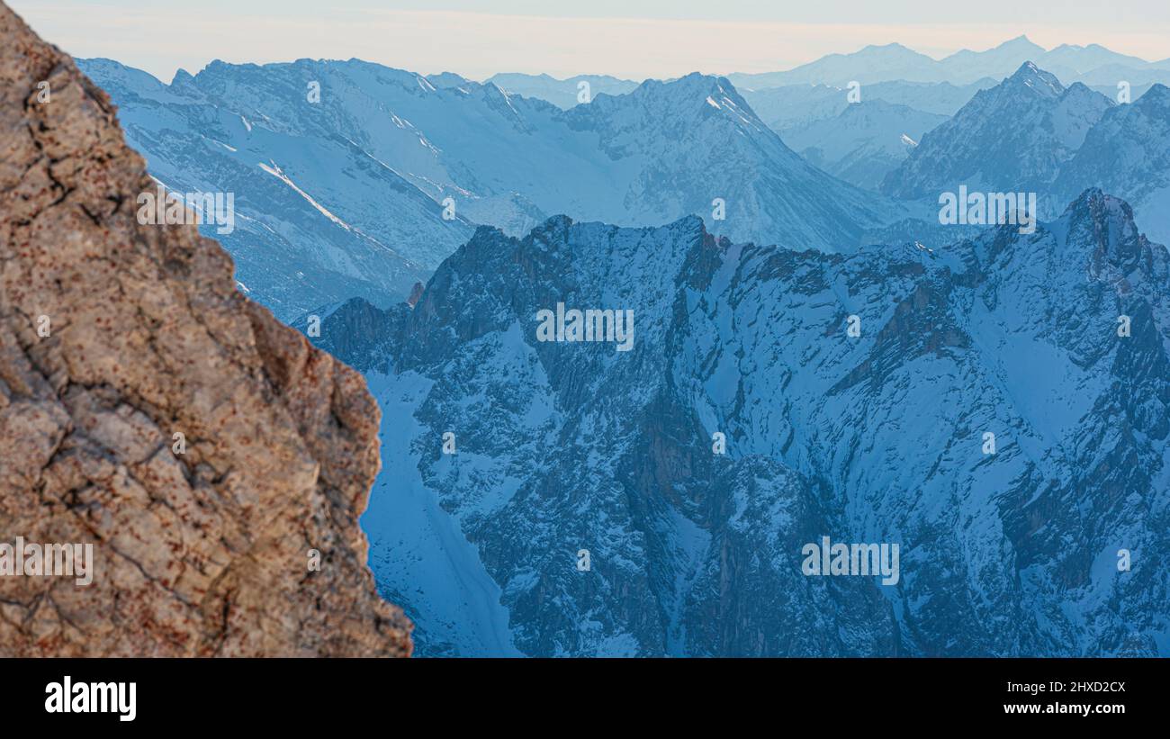 Morning mood on the Zugspitze, sunrise on Germany's highest mountain 'Top of Germany'. Landscape photography. View into the Reintal valley. Stock Photo