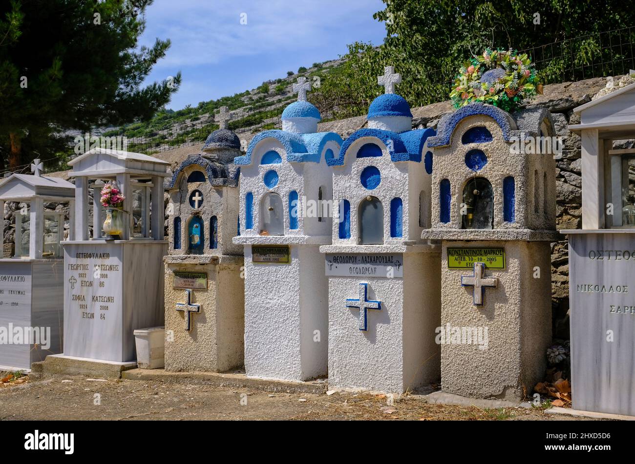 Theologos, Thassos, Greece - Greek Orthodox cemetery with traditional small prayer chapels in the mountain village of Theologos on the island of Thassos. The mountain village Theologos is a popular destination for vacationers. Thassos belongs to Eastern Macedonia and Thrace, also Eastern Macedonia and Thrace. Stock Photo