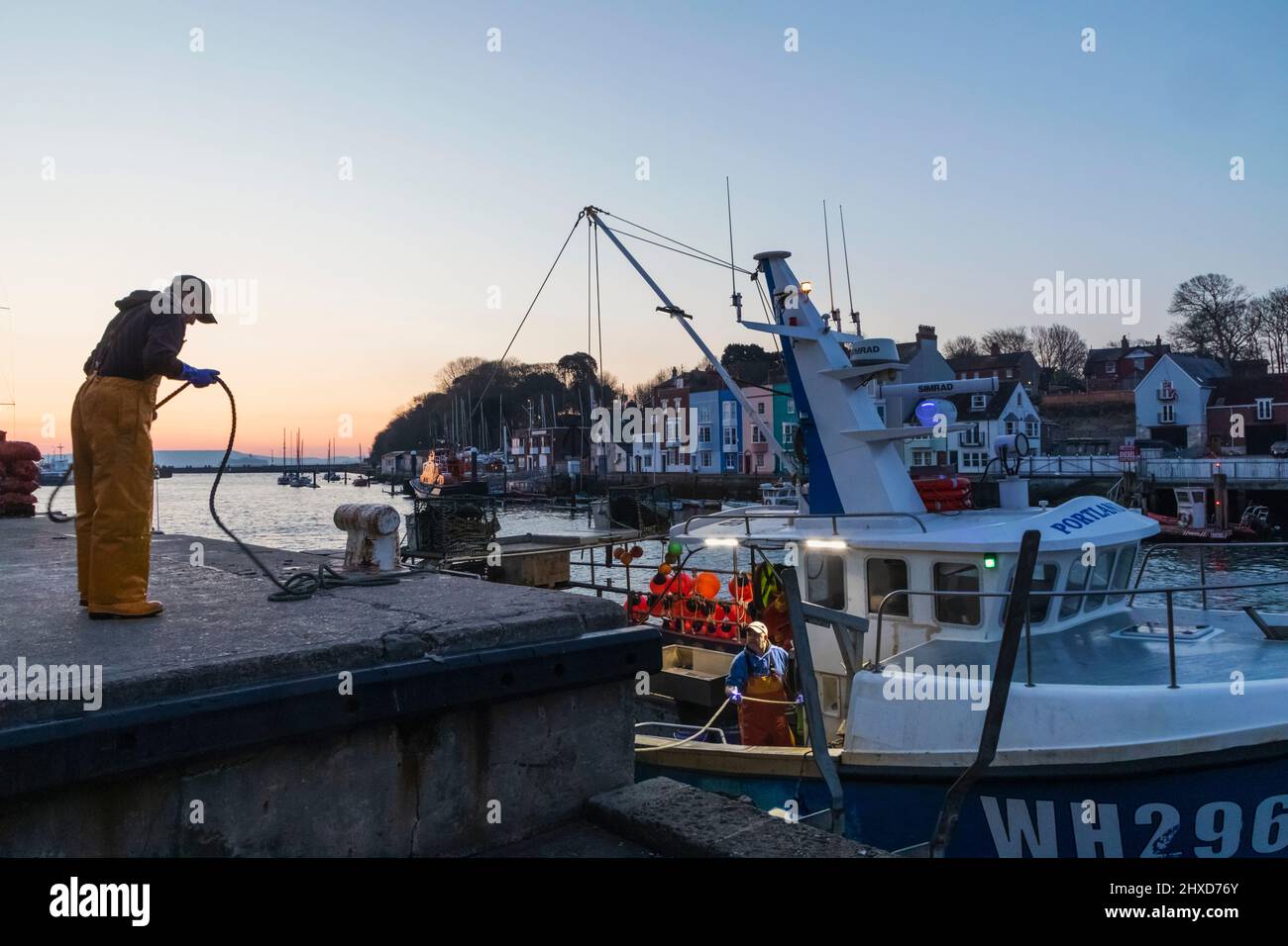 England, Dorset, Weymouth, Weymouth Harbour, Fisherman Preparing to Depart Stock Photo