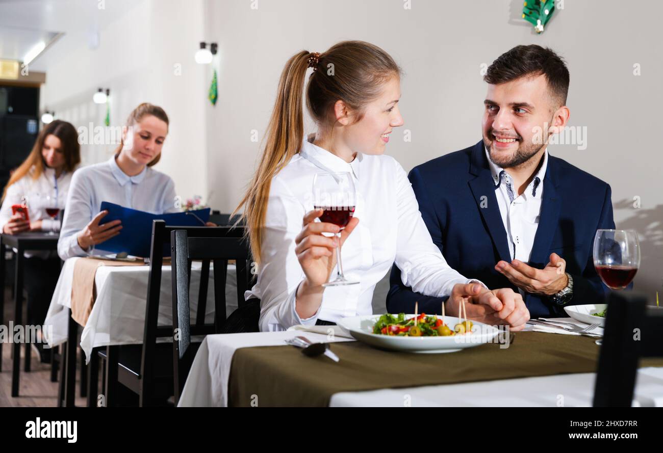 Gentleman with elegant woman are having dinner in luxury restaurante ...