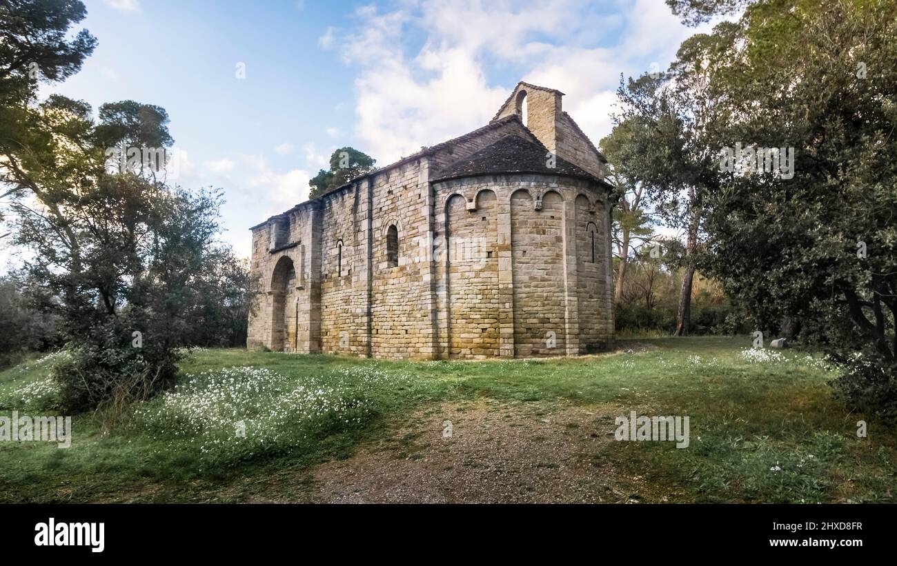 Chapel of Saint Germain de la Serre near Cesseras. It was built in the XI - XII century. It has a Romanesque-Lombard head with a single apse. Monument historique. The commune territory belongs to the Regional Natural Park of Haut Languedoc. Stock Photo