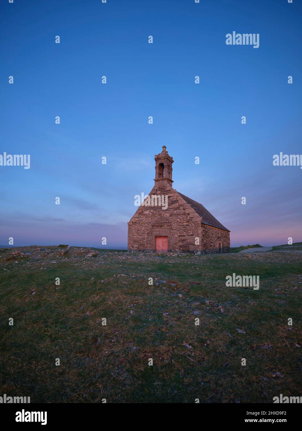 The chapel of the same name on Mont Saint-Michel de Brasparts is from the 17th century and is located on one of the peaks of the Monts d'Arrée mountain range in the department of Finistère in Brittany, the peak is 381 meters high and a popular destination for excursions. Stock Photo