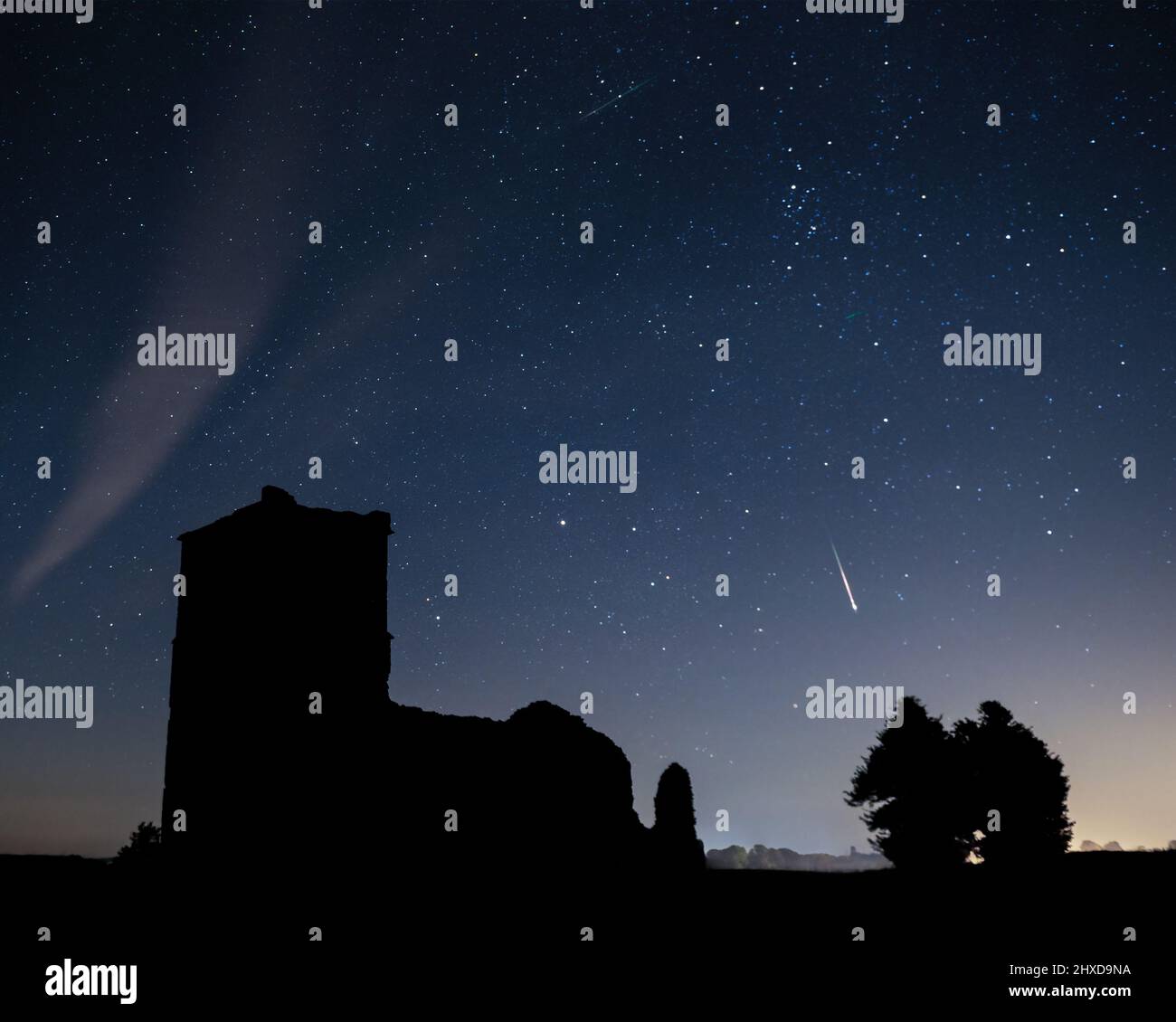 Meteors in the night sky above Knowlton Church, Cranborne, Dorset
