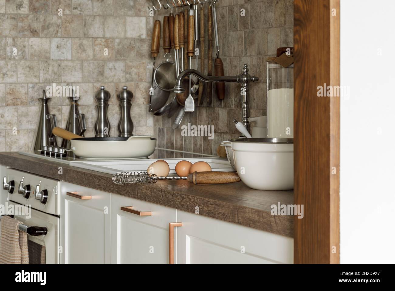 Modern kitchen utensils in contemporary kitchen interior. Comfortable
