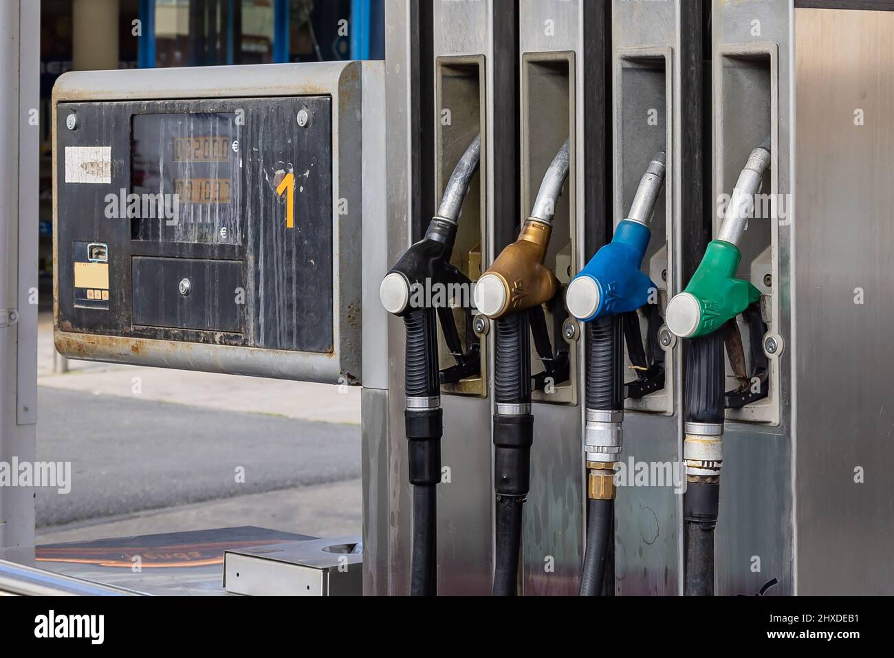 Pump nozzles of a petrol pump in service station Stock Photo