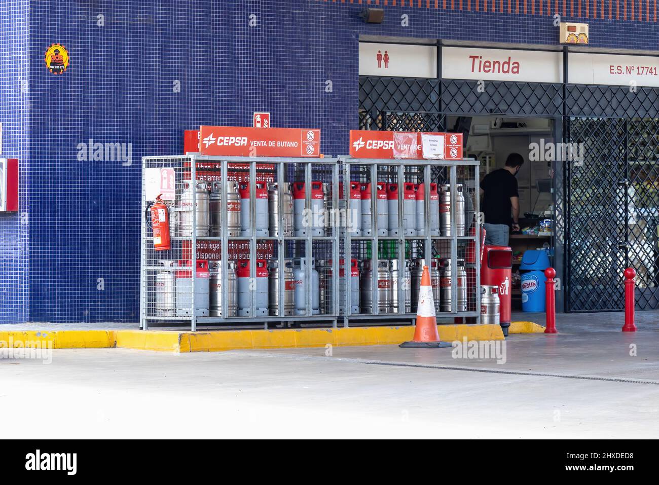 Huelva, Spain - March 10, 2022: Cepsa gas cylinders of butane and propane for sale at a Service station Stock Photo