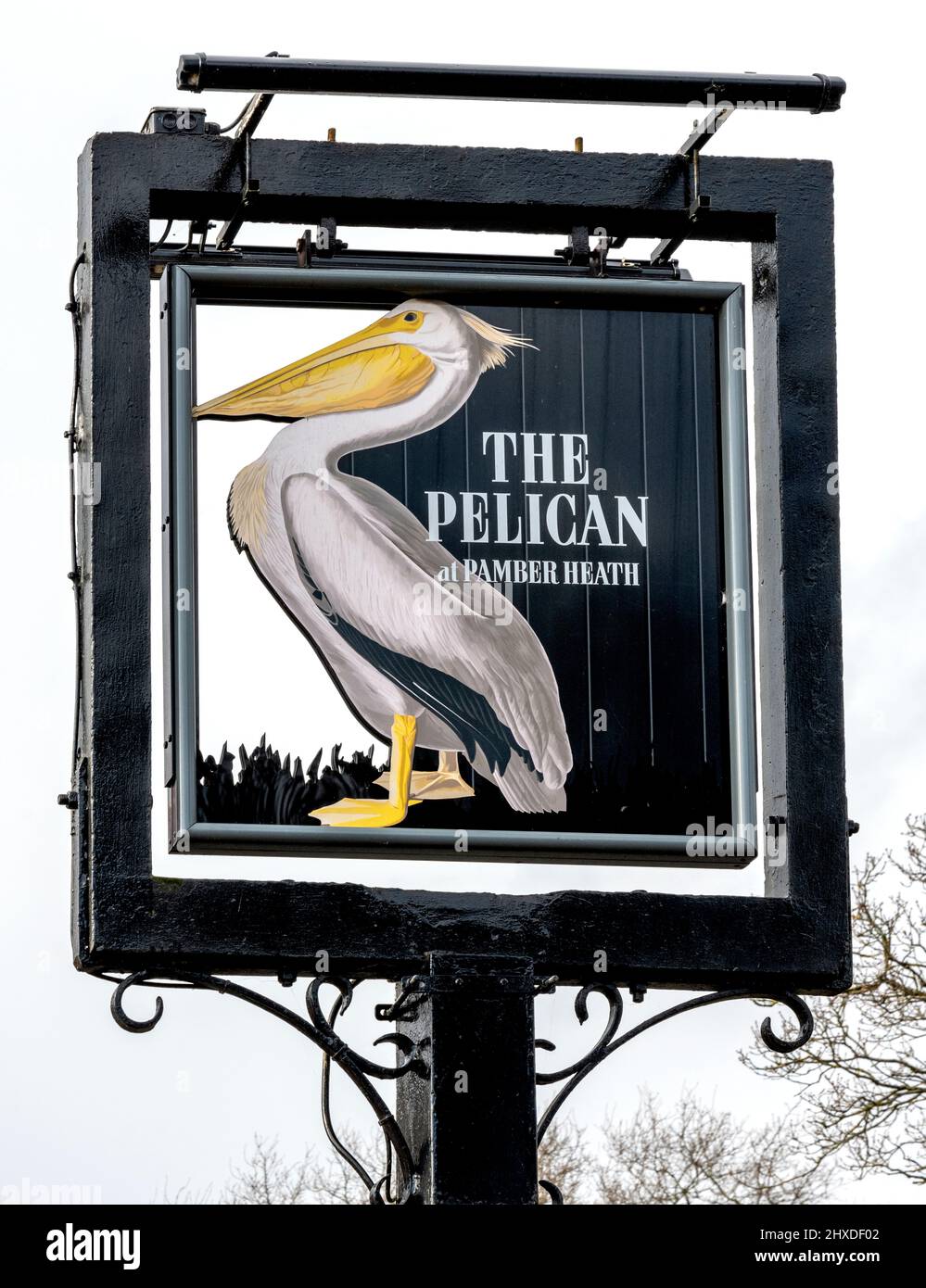 Traditional hanging pub sign at The Pelican public house, Silchester Road, Pamber Heath, Tadley, Hampshire, England, UK Stock Photo