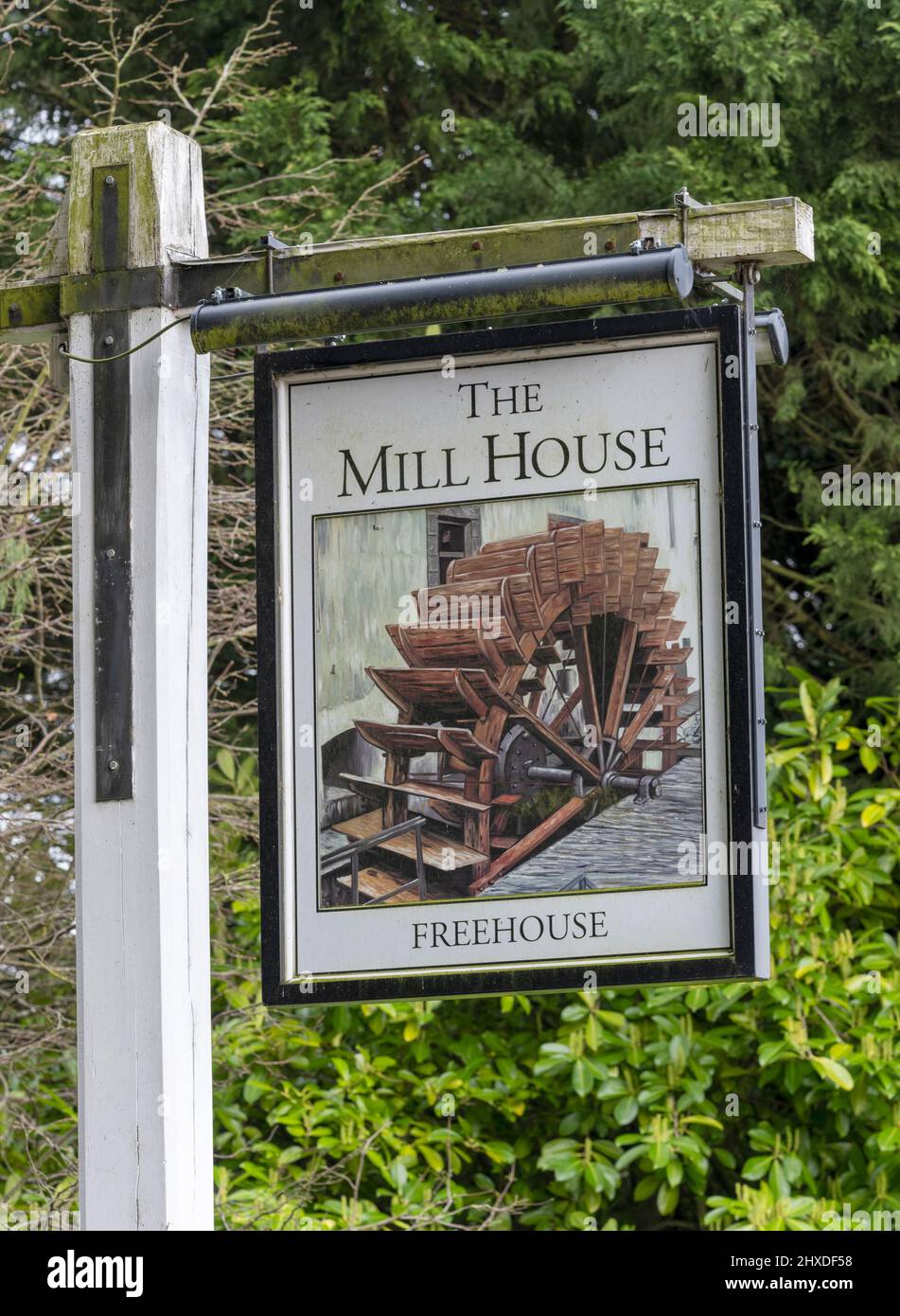 Traditional hanging pub sign at The Mill House - freehouse public house - North Warnborough, Hook, Hampshire, England, UK Stock Photo