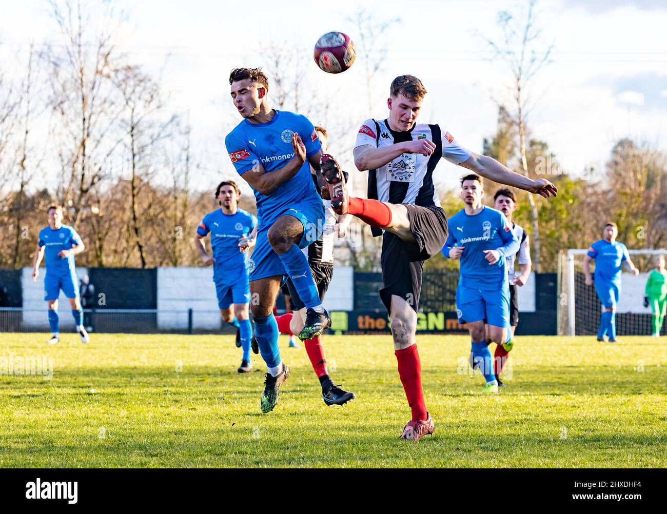 Kendal Town FC hosted Warrington Rylands 1906 FC at Parkside Road, Kendal, for a non-league match of the 2021-2022 season. Scott Bakkor gets tackled Stock Photo