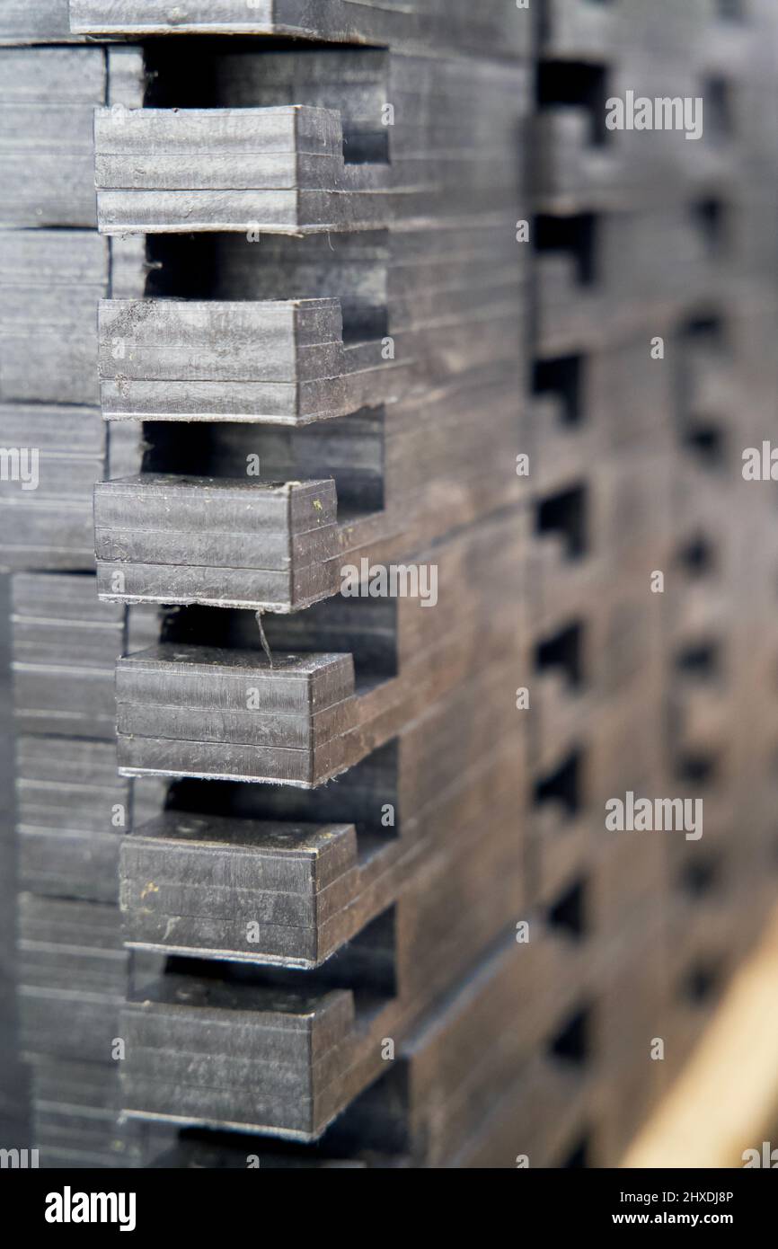 Pile of recycled plastic construction material made from restmix waste plastics on a recycling