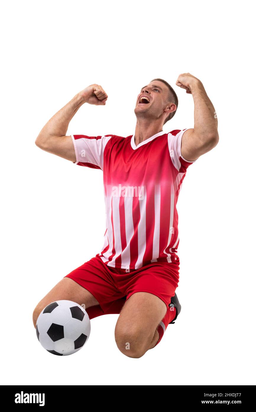 Excited young caucasian male soccer player celebrating goal while