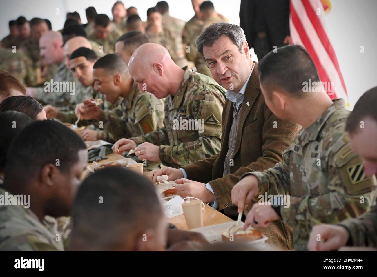 Grafenwoehr, Germany. 11th Mar 2022. Markus SOEDER (Prime Minister of Bavaria and CSU Chairman) speaks to American soldiers on the occasion of a Weisswurst meal, Bavarian Weisswurst Fruehstueck Prime Minister Dr. Markus Soeder visits the US military training area Grafenwoehr, headquarters of the 7th Army Training Command on March 11th, 2022. Credit: dpa picture alliance/Alamy Live News Stock Photo