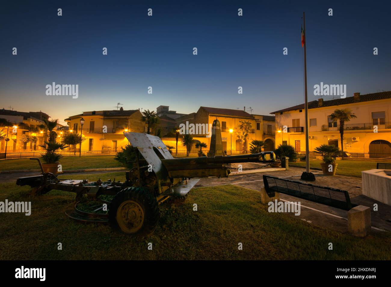 An Italian artillery piece at sunrise in Piazza Caduti in Guerra, a memorial to war dead from the small town of Carinaro, Italy. Stock Photo