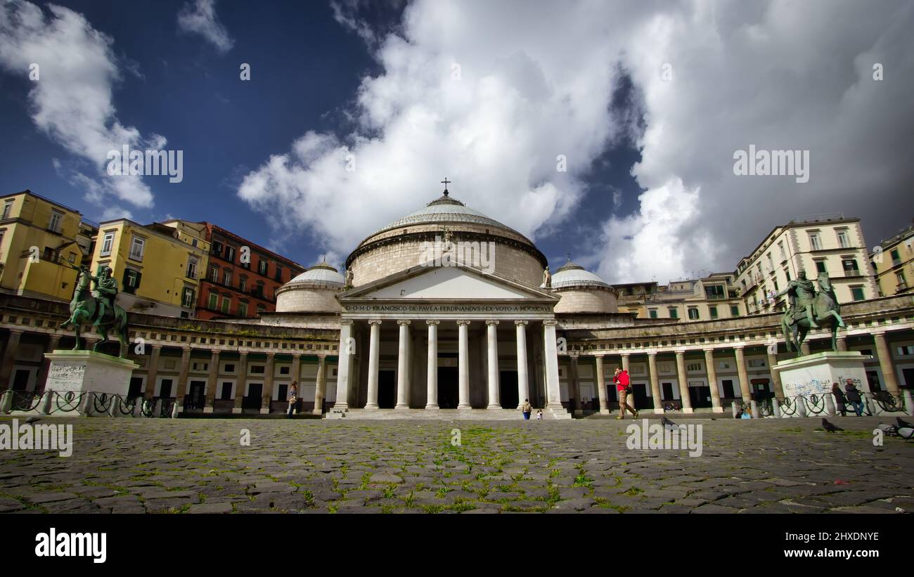 A sunny day in front of Basilica Reale Pontificia San Francesco da Paola, completed in 1816, and located at Piazza Plebiscito in Naples, Italy. Stock Photo