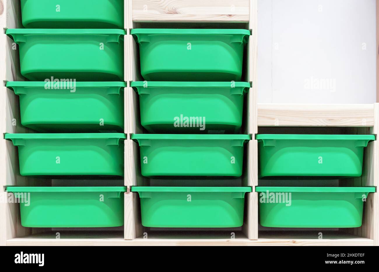 Green plastic containers for storing children's things Stock Photo Alamy