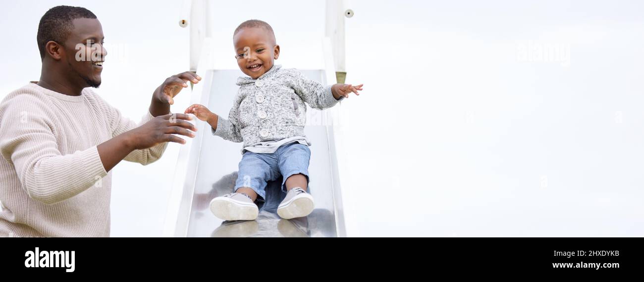 Life is playfulness. Shot of a father and son playing in the park. Stock Photo