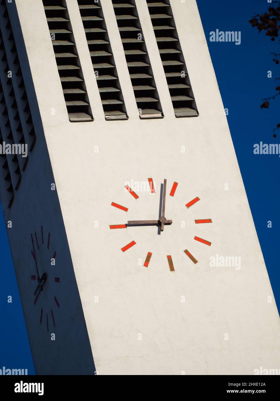 Modern Minimalist Tower Clock Closeup on a Sunny Day Stock Photo
