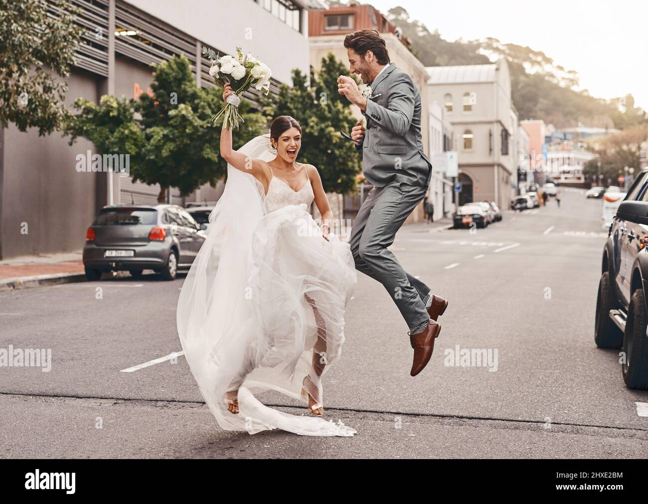 Nothing feels better than marrying your best friend. Shot of a beautiful  couple out in the city on their wedding day Stock Photo - Alamy, image size:1300x1010