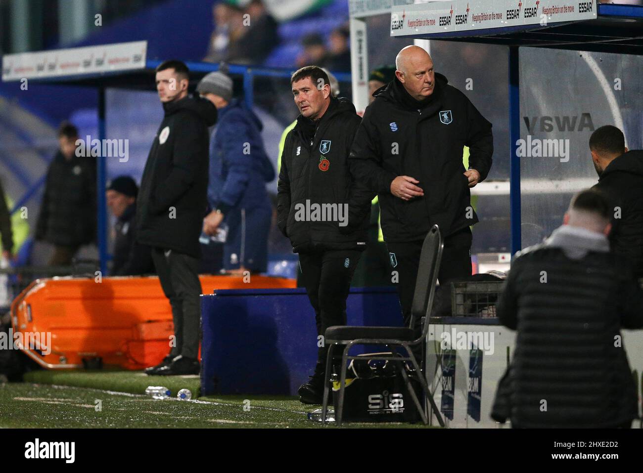 Birkenhead, UK. 11th Mar, 2022. Mansfield Town Manager Nigel Clough (c) looks on from the dugout. EFL Skybet Football league two match, Tranmere Rovers v Mansfield Town at Prenton Park, Birkenhead, Wirral on Friday 11th March 2022. this image may only be used for Editorial purposes. Editorial use only, license required for commercial use. No use in betting, games or a single club/league/player publications.pic by Chris Stading/Andrew Orchard sports photography/Alamy Live News Credit: Andrew Orchard sports photography/Alamy Live News Stock Photo