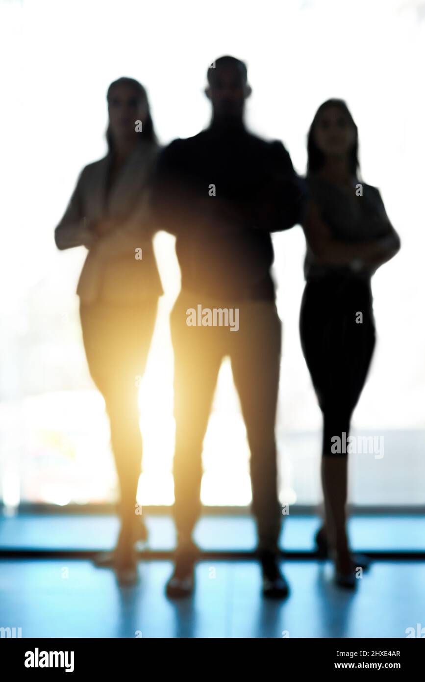 Stand tall and aim taller. Silhouette of a group of confident