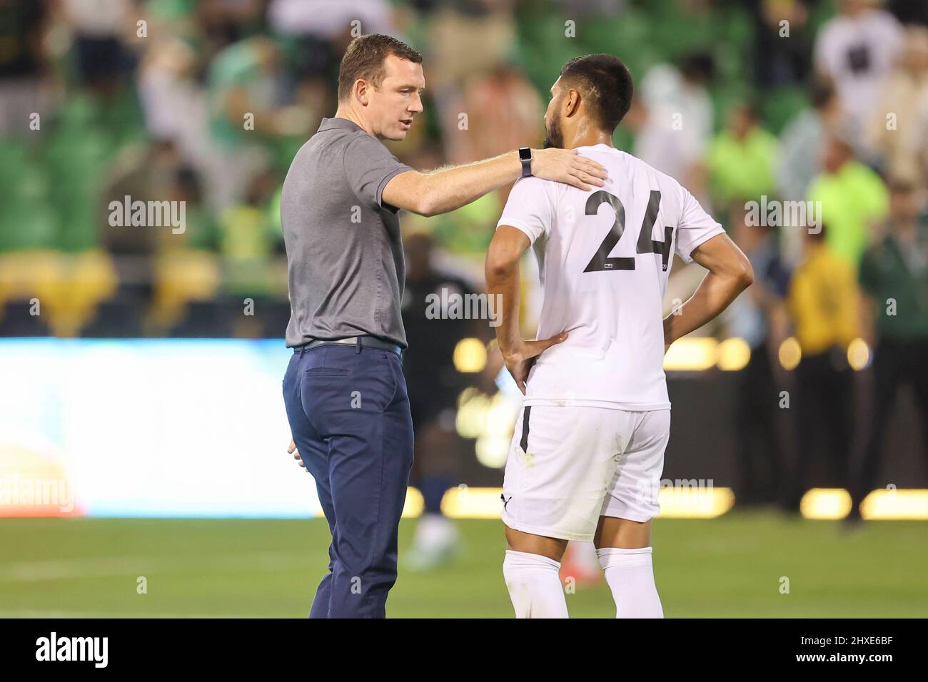 St. Petersburg, FL USA;  Tampa Bay Rowdies head coach Neill Collins congratulates one of his new players during a USL preseason soccer game against To Stock Photo