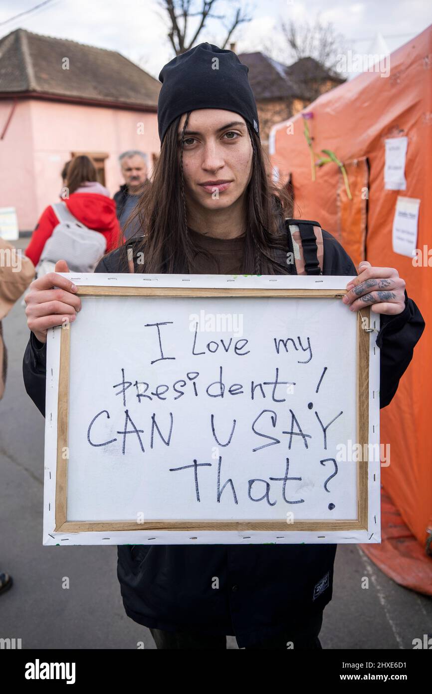 Ukraine, Ukraine. 9th Mar, 2022. A Ukrainian painter shows the back of