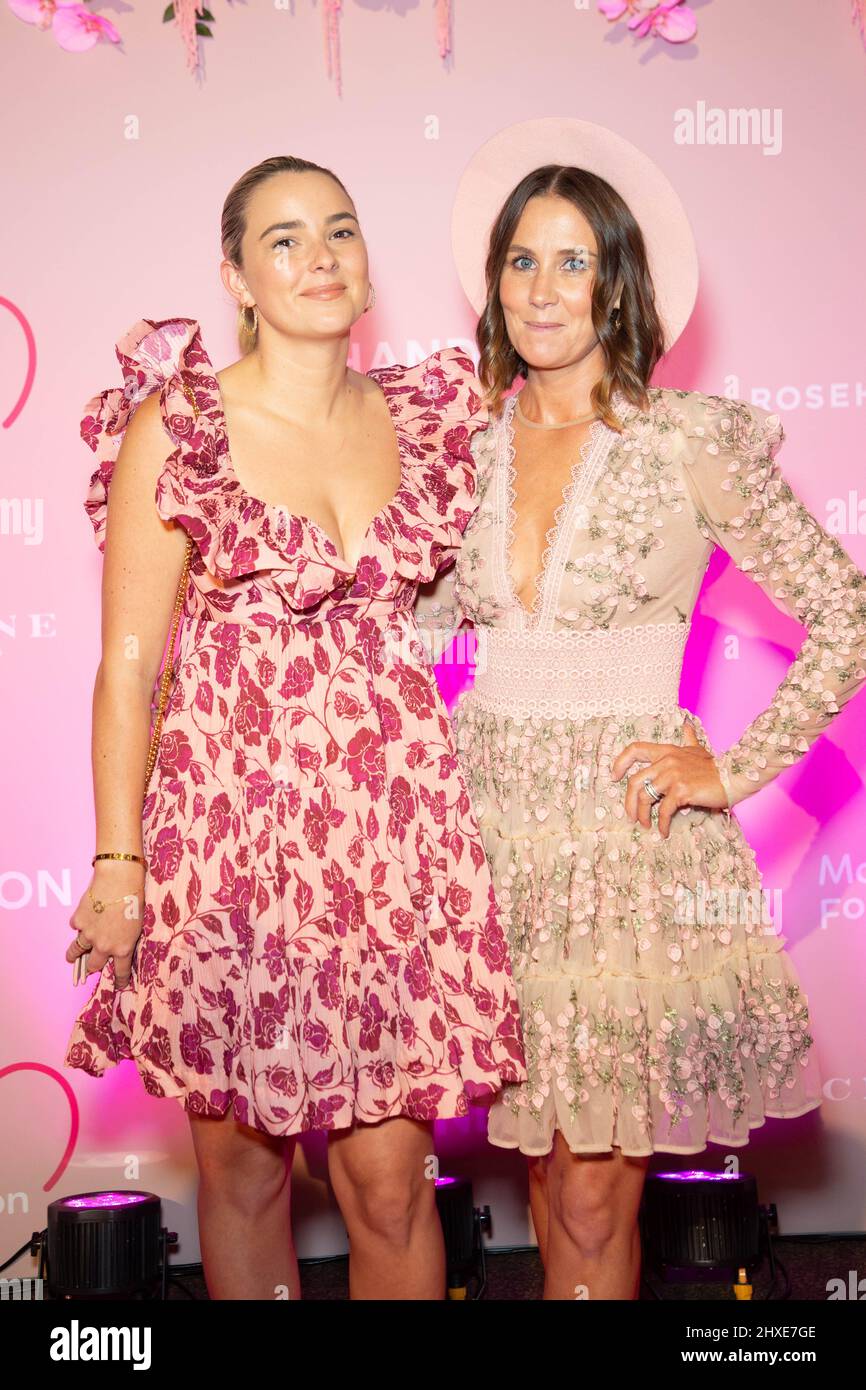 Sydney, Australia. 12th March 2022. VIP Pink Carpet Arrivals for Chandon Ladies Day, Pink Fashion Lunch supporting the McGrath Foundation at the Grand Pavilion, Level 2, Rosehill Gardens as part of the Autumn Racing Carnival. Pictured: Cathy McEvoy (right), wife of champion jockey Kerrin McEvoy and guest. Credit: Richard Milnes/Alamy Live News Stock Photo