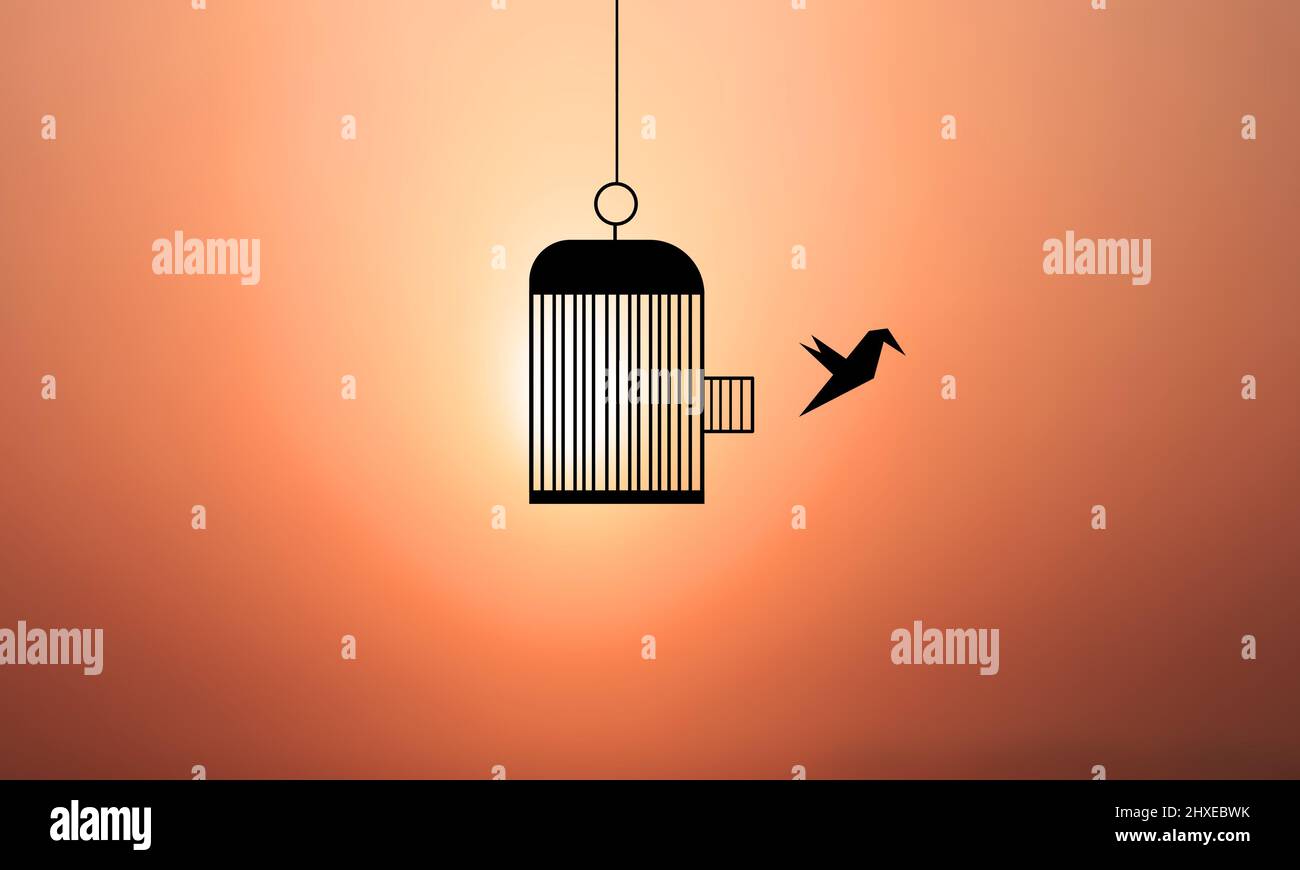 Bird cage freedom Sunset Beach background. Bird Escape and Fly Away Stock Photo