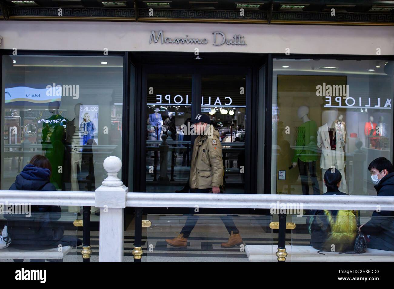Moscow, Russia. 11th Mar, 2022. A man walks by Massimo Dutti's boutique in  Moscow. The Spanish fashion retailer Inditex, which owns such brands as  Zara, Bershka, Pull&Bear, Massimo Dutti, Stradivarius, and others,