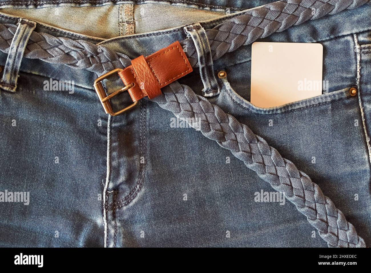 The upper part of old worn blue jeans 